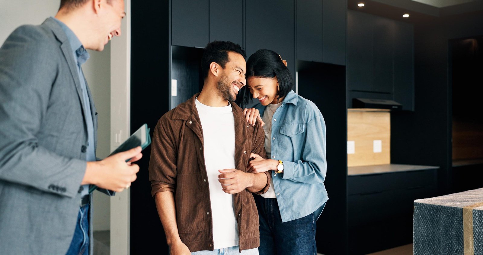 Market Connect Realty agent meeting with clients in a home